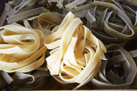 dry pasta on the wooden tableの写真素材