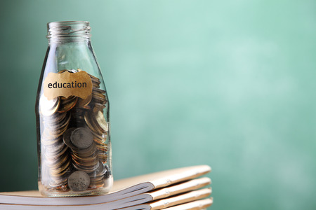 saving jar with coin for eductionの写真素材
