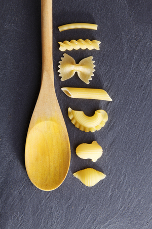 Variety of types and shapes of Italian pasta. Dry pasta backgroundの写真素材