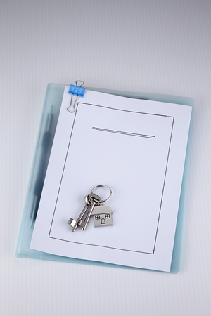 House shaped keychain with keysの写真素材