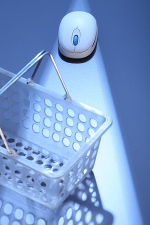 empty basket with wireless mouseの写真素材