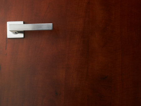 door handle on the wooden background