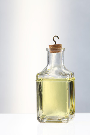 olive oil in bottles on the white backgroundの写真素材