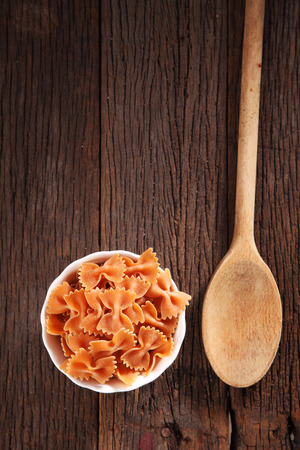 farfalle pasta on the wooden backgroundの写真素材