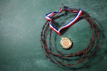 trophy surrounded by the barbwireの写真素材