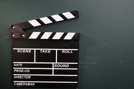 clpper board on the blackboardの写真素材