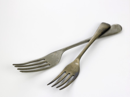 old fork on the white backgroundの写真素材