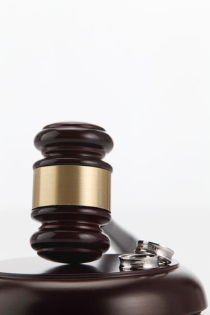 Divorce decree and wooden gavel on white backgroundの写真素材