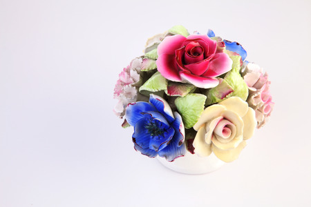 colorful porcelain flowers on the white backgroundの写真素材