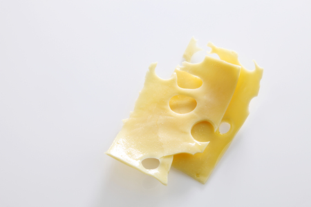 melted cheese on the white backgroundの写真素材