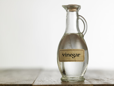 white vinegar on the wooden table topの写真素材
