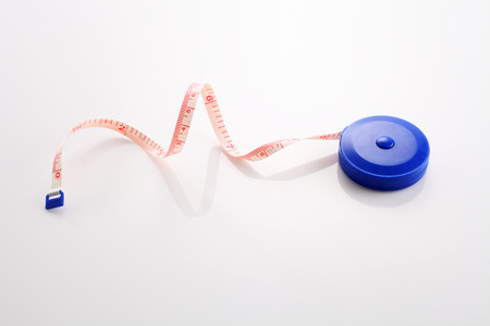 tape measuring tape on the white backgroundの写真素材