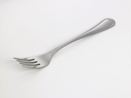 single stainless steel fork on the white background