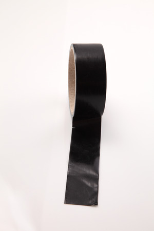 roll of black color cloth tape on the white backgroundの写真素材