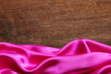 satin fabric on the wooden backgroundの写真素材