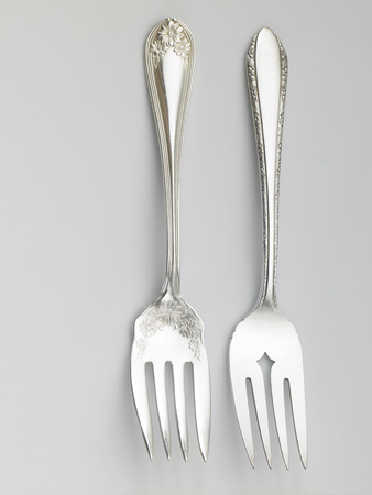 used fork on the white backgroundの写真素材