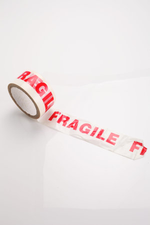 Roll of packing tape on white