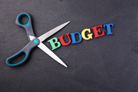 scissors with text budget  on the black backgroundの写真素材
