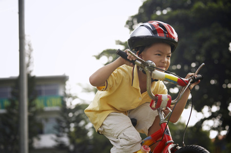 Boy riding bicycleの写真素材