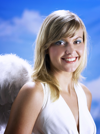 Close up of angel looking at camera, with beautiful smileの写真素材