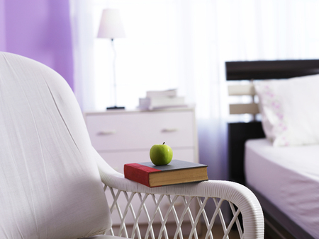 Portrait of chair next to the bedの写真素材