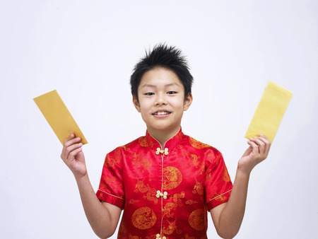 boy showing his gift packetsの写真素材