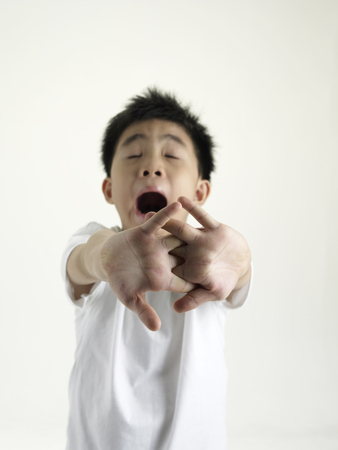 boy yawning and stretching stretching  at the same timeの写真素材
