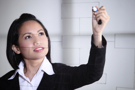 Woman drawing a chartの写真素材