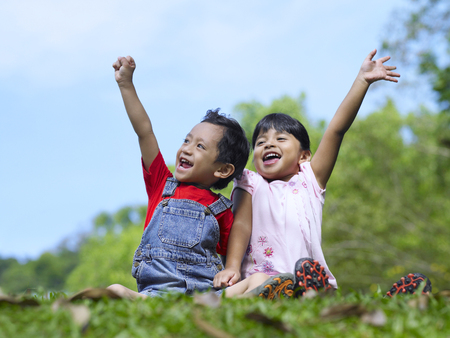 kids playing in a parkの写真素材
