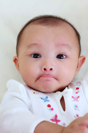 Close up of baby with lip folded