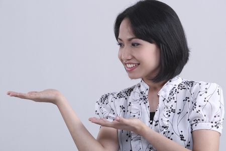 woman with hand gesturesの写真素材