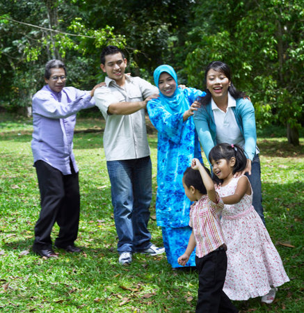 family playing games at the park