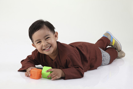 malay boy grinningの写真素材