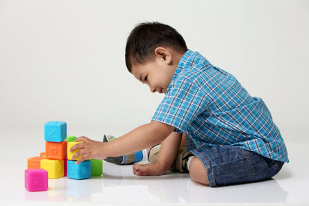 malay boy playing blocks