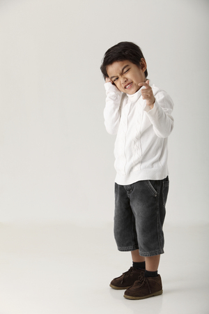 studio shot of kid on the white backgroundの写真素材