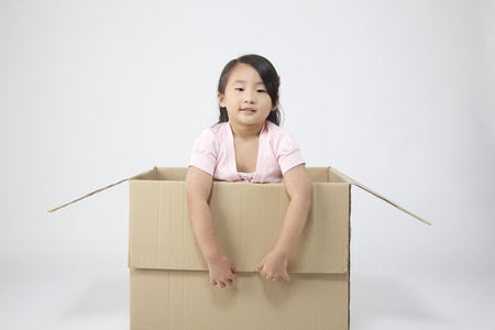 Little girl inside the boxの写真素材