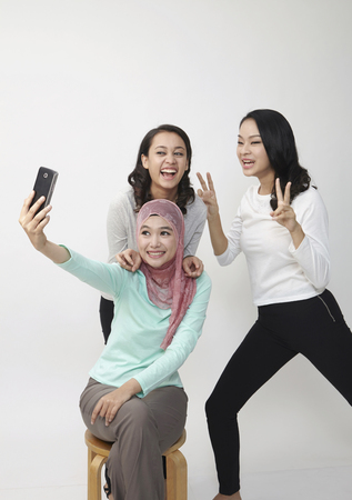 woman self portrat with mobile phoneの写真素材