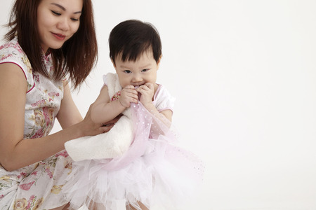mother and daughter with party dressの写真素材