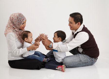 family playing together on the white background