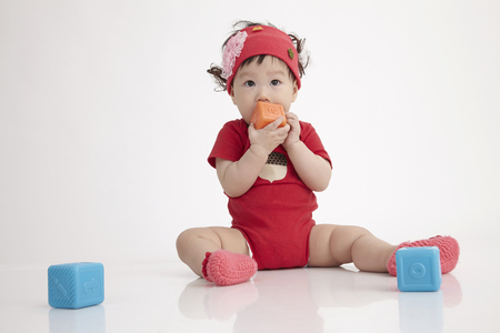 chinese baby  playing with alphabet blockの写真素材