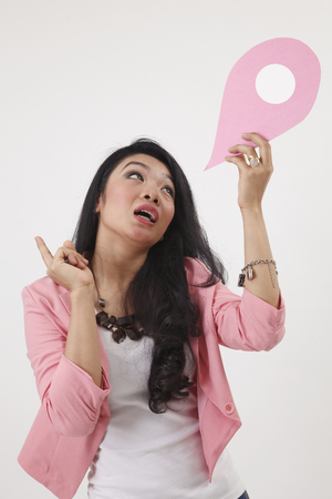 malay woman holding a landmark or location symbolの写真素材