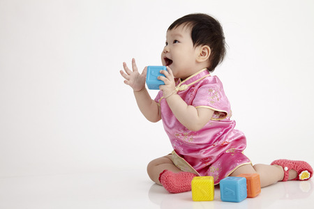 chinese baby  playing with alphabet blockの写真素材