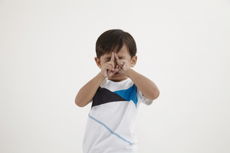 malay two fingers on the forehead concentrateの写真素材