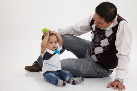 malay family man playing with his child