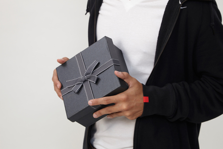 man holding an exclusive presentの写真素材