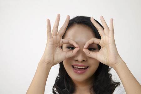 chinese woman showing ok signの写真素材