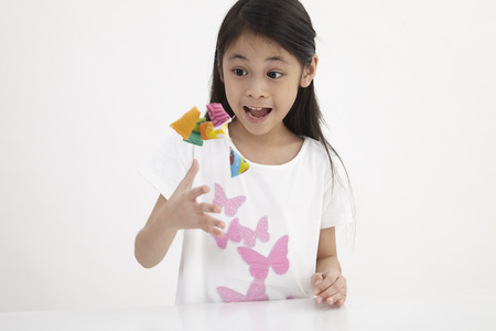 malay girl playing traditional game batu seremban or Serembatの写真素材
