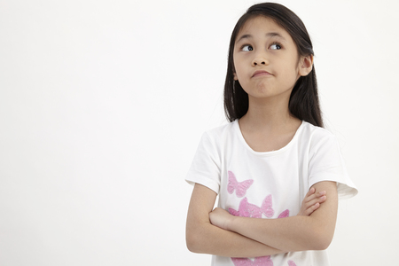 Proud  little girl with her arms crossedの写真素材