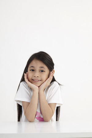 little girl hand on the chinの写真素材