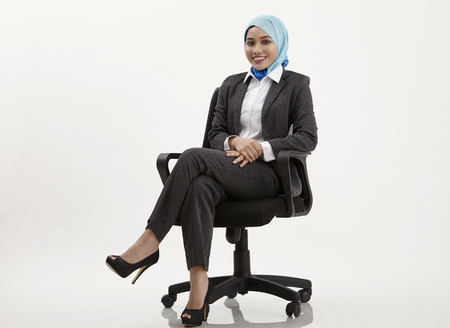 malay woman with tudung looking at camera with confidientの写真素材